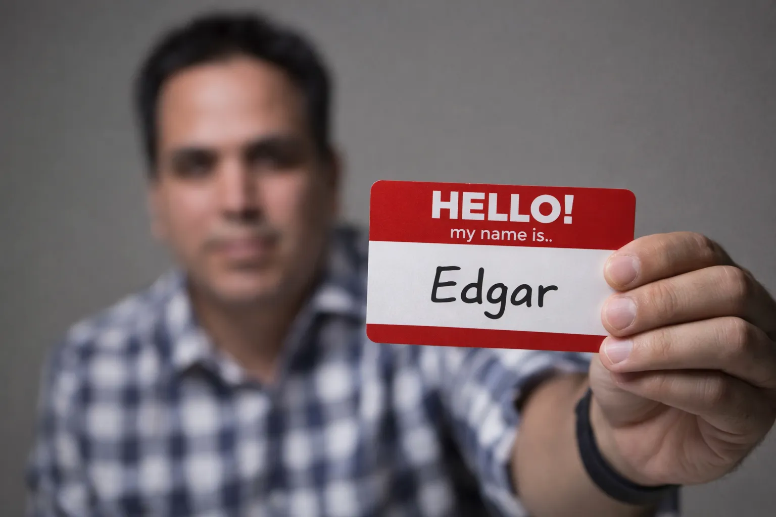 Edgar holding a name tag